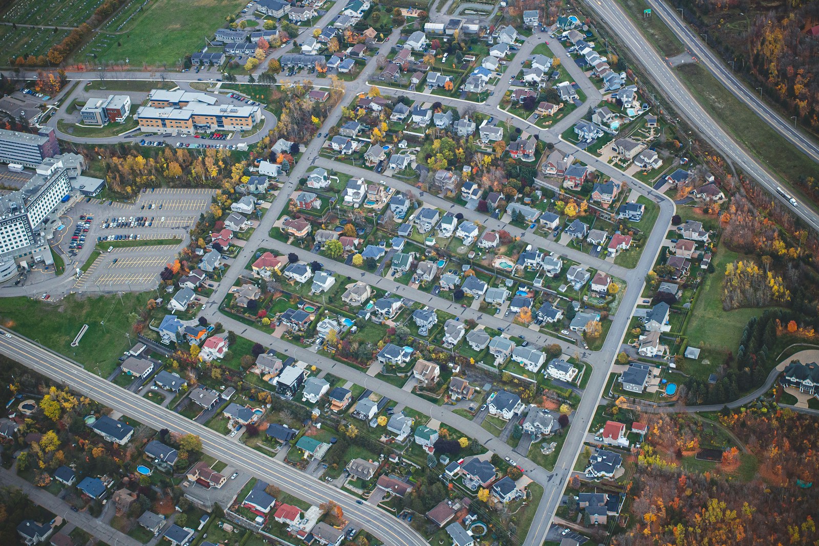 an aerial view of a city with lots of houses
